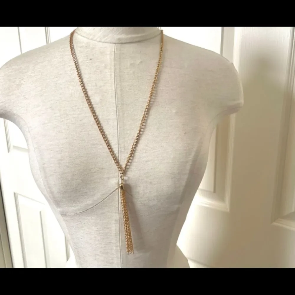 Gold tone long tassel necklace
